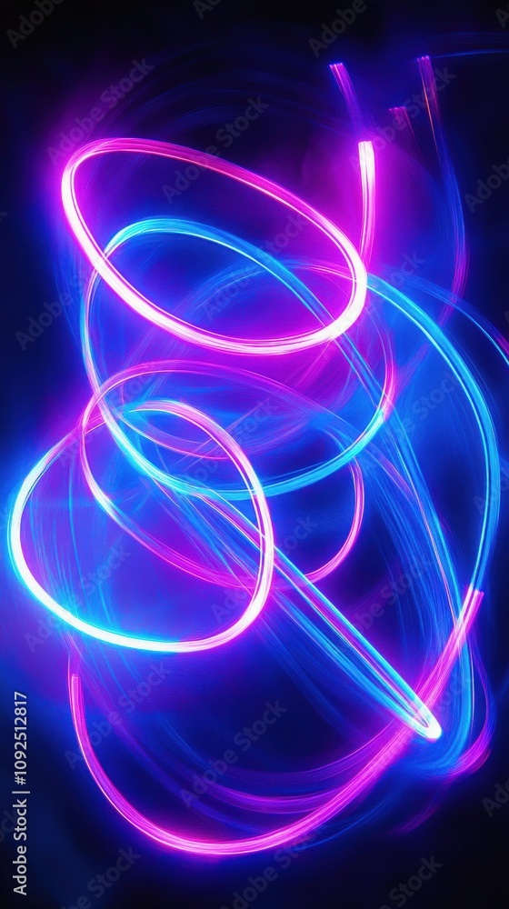 Bright blue and pink light trails intertwine and flow in abstract shapes against a dark backdrop, showcasing motion and creativity in a vibrant display of colors.