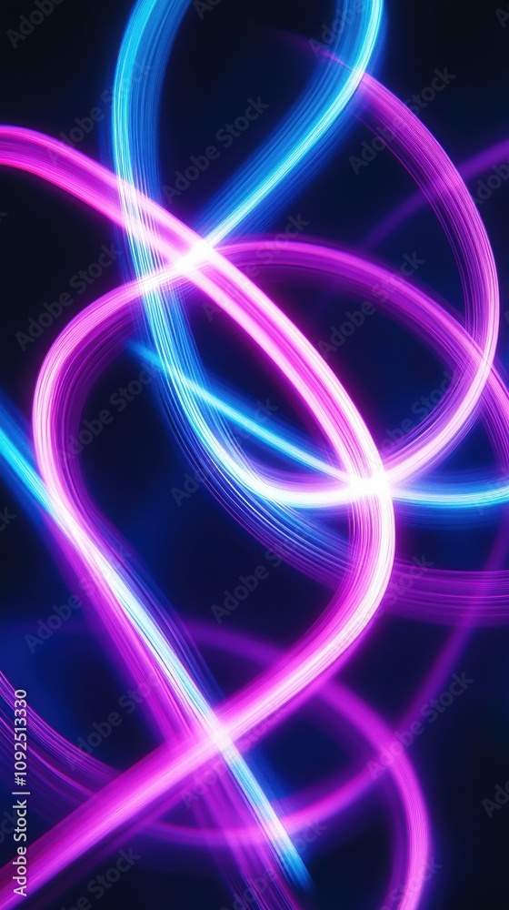Bright pink and blue light trails intersect and swirl against a dark background, creating a dynamic and mesmerizing visual effect.