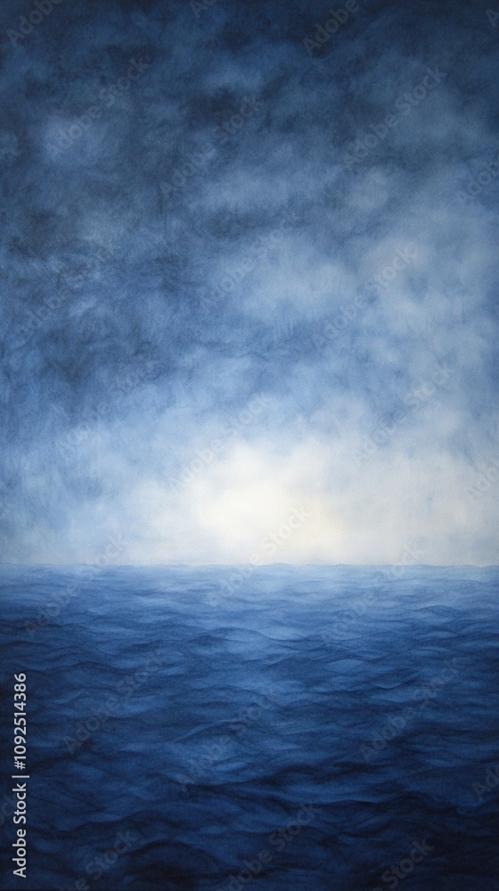 Soft blues blend together in a tranquil seascape at dawn, depicting gentle waves under a misty sky. The calm waters reflect the peaceful atmosphere of the early morning light.