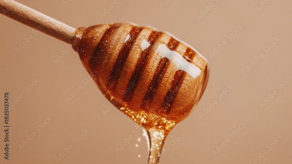 A wooden dipper holds golden honey, with droplets glistening as they fall. The warm colors and soft lighting enhance the rich texture, showcasing the natural sweetness of the honey.